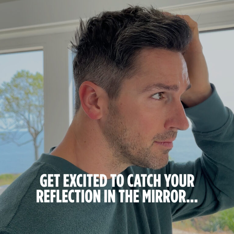 Man looks in the mirror, happy with his Nutrafol results