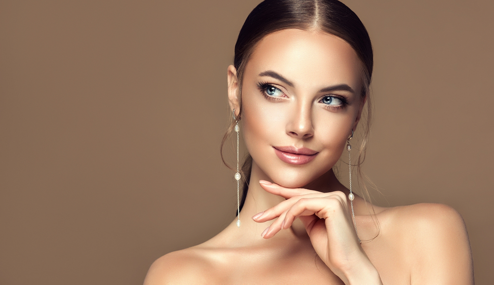 Woman in Camp Hill looks to the side and smile, showing her beautiful, full lips after a lip flip with fillers